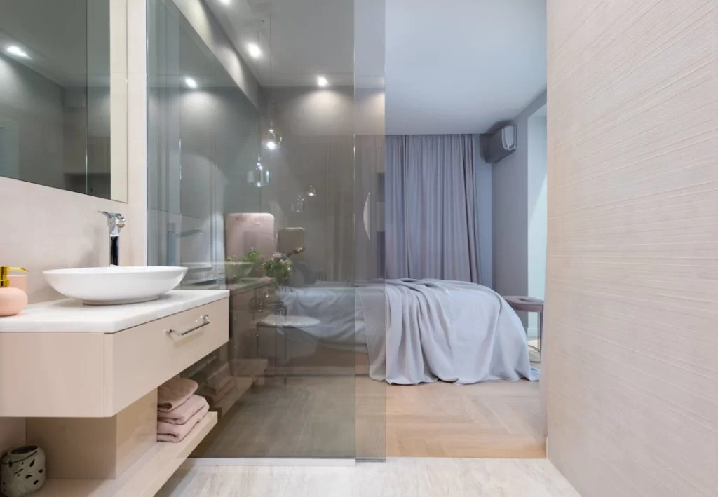modern bedroom with glass partition bathroom design